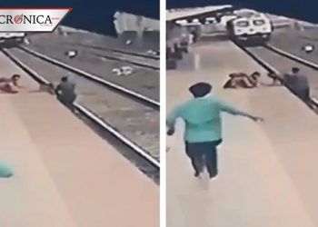 Hombre salva a niño de morir aplastado por tren en India (VIDEO)