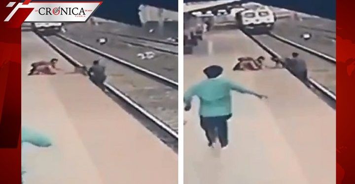 Hombre salva a niño de morir aplastado por tren en India (VIDEO)